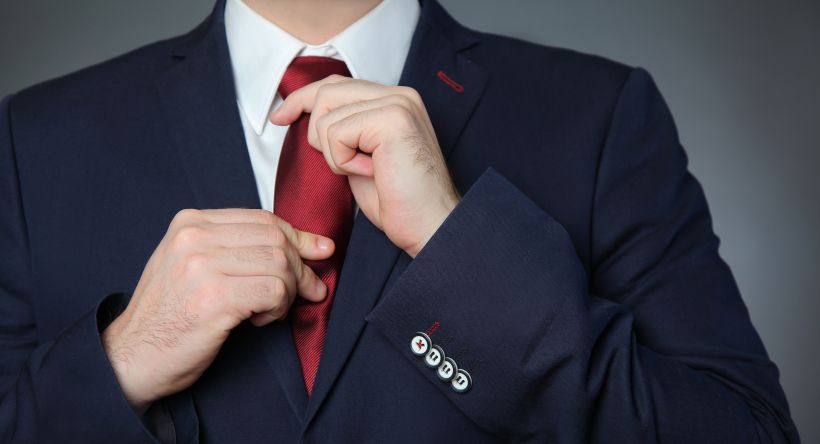 Man wearing blue business suit and tie