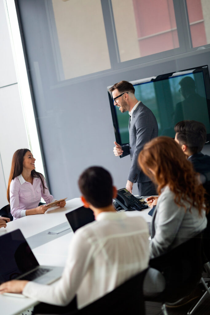 Corporate business team and manager in a modern meeting room